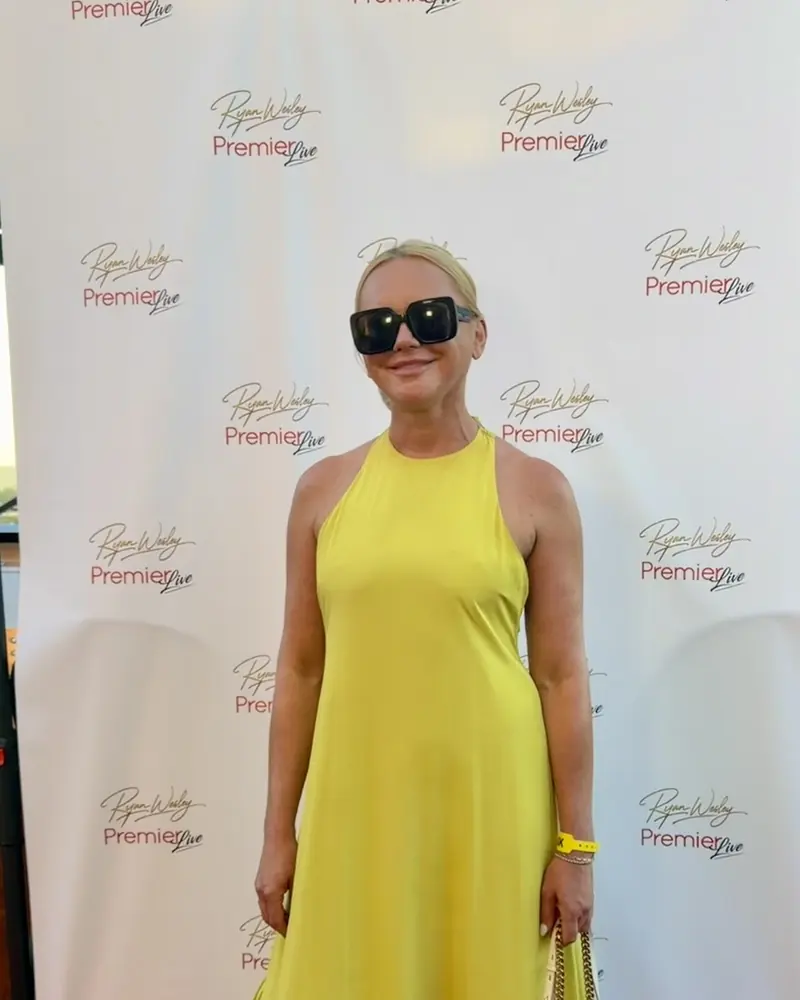 Galyna in a chartreuse maxi dress and sunglasses at a premiere